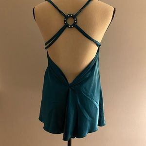 NWOT Beautiful teal blouse with flattering back design